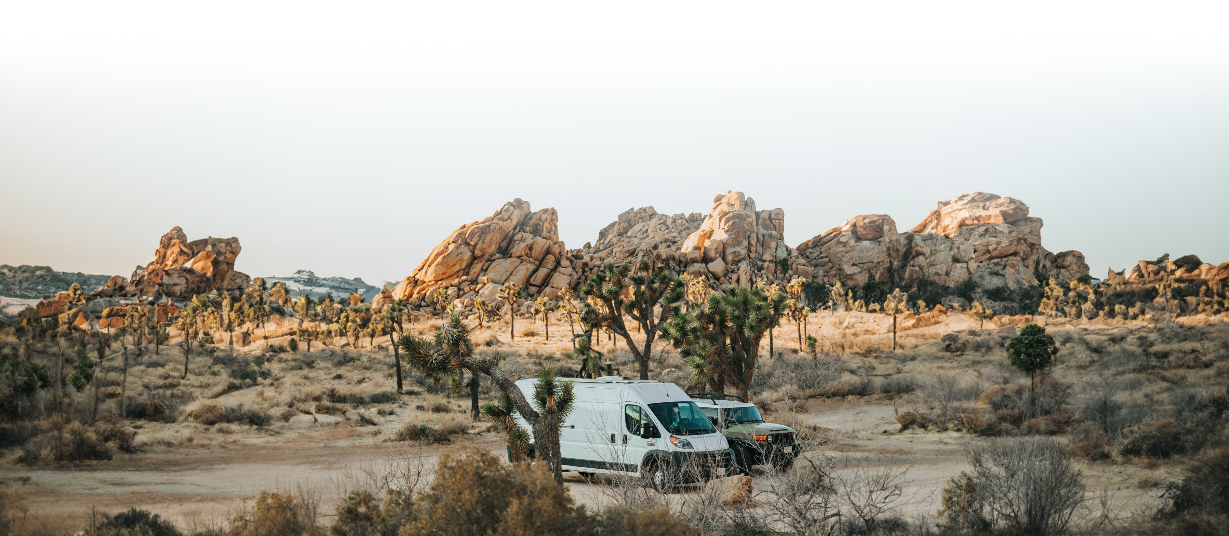 TBB LIBERGRID supports RV adventures with reliable power solutions, featuring a van and jeep in a scenic desert landscape