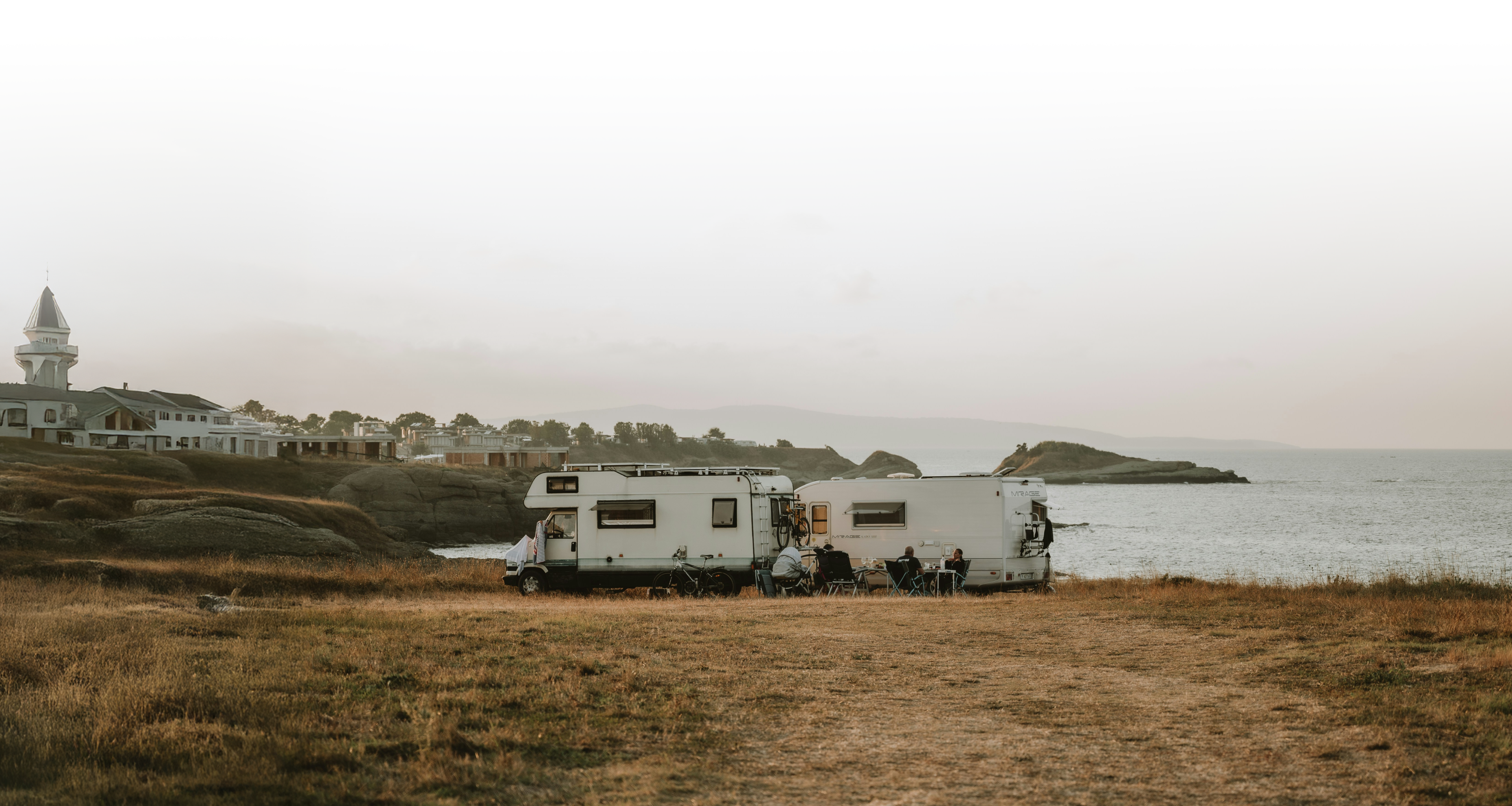 TBB Partner Portal login page, designed for partners supporting RV and off-grid power systems with scenic coastal camping background